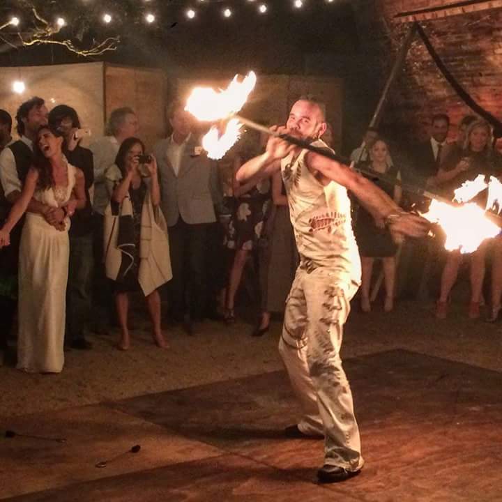 performing their fire dance duet for a private wedding in wine country Mexico wedding entertainment fire show